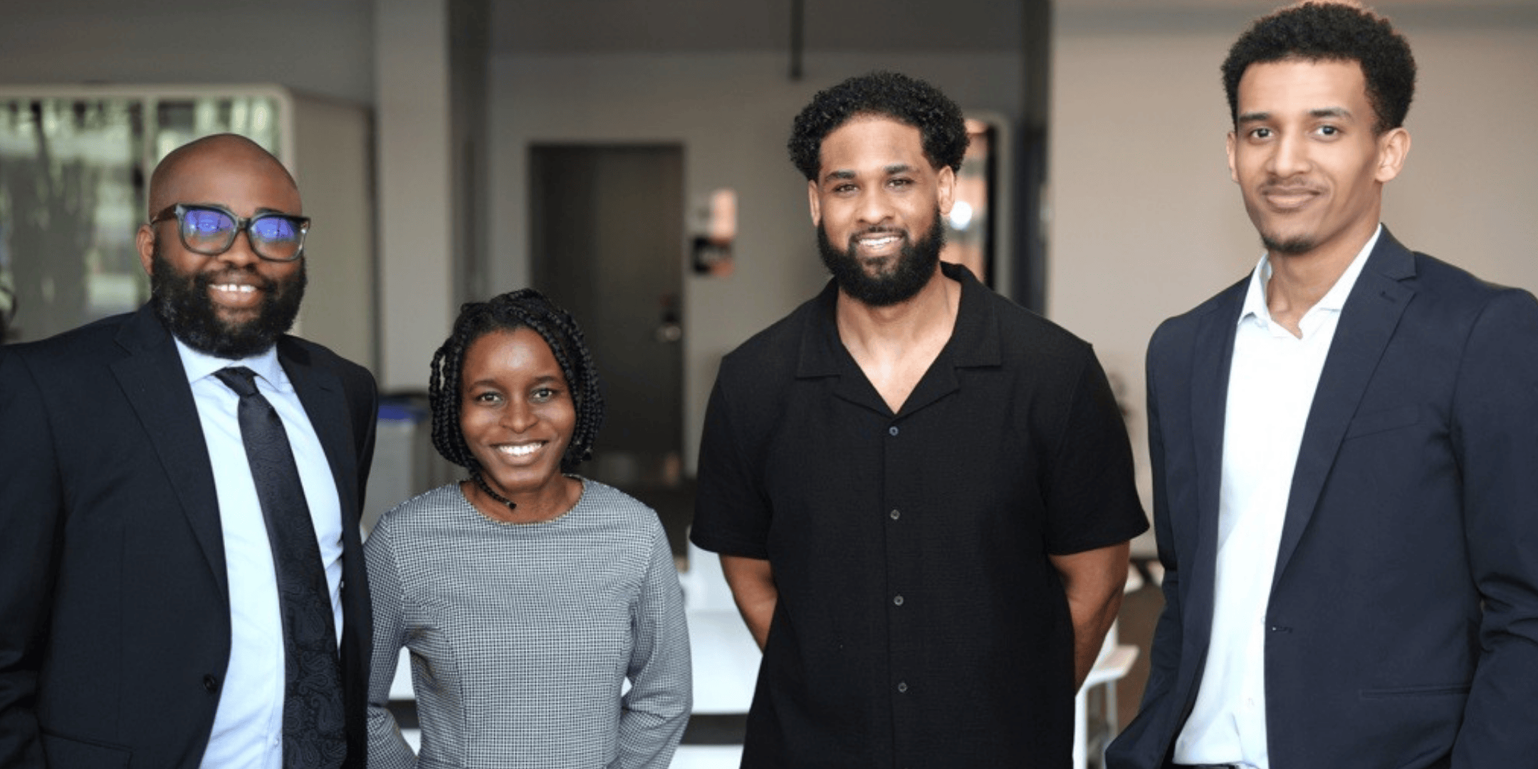 A group of BBI employees standing in Black and grey clothing